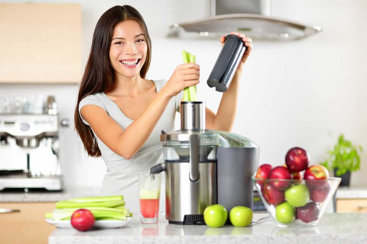 Image of woman making celery juice.